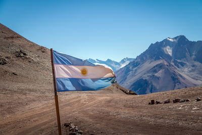 Scenic view of mountains against clear blue sky