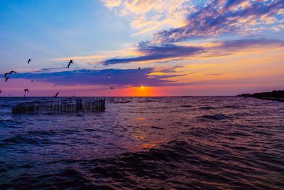 Scenic view of sea against sky during sunset