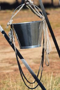 Close-up of chain swing hanging on field