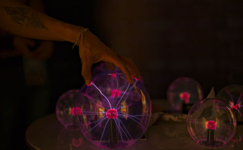 Close-up of hand holding glass decoration