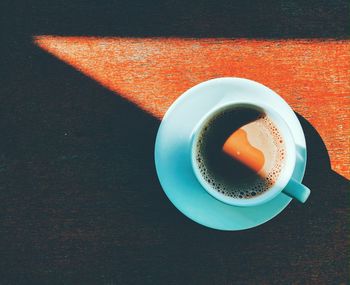 High angle view of coffee cup on table