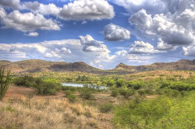 Scenic view of mountains against cloudy sky