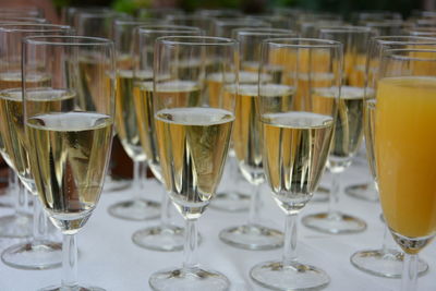 Champagne flutes arranged on table