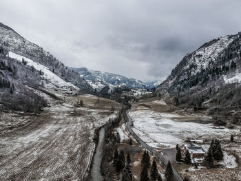 Scenic view of mountains against sky during winter