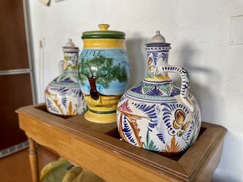 Close-up of potted plant on table. jars to store oil