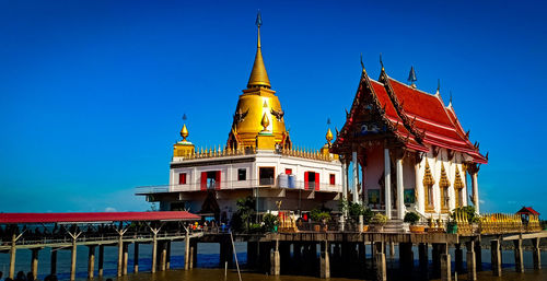 Temple building against clear blue sky