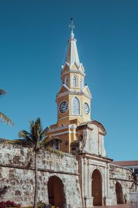 Low angle view of building against blue sky
