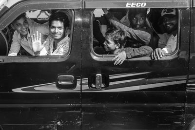 Portrait of people sitting in car