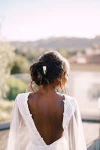 Rear view of bride looking at view outdoors