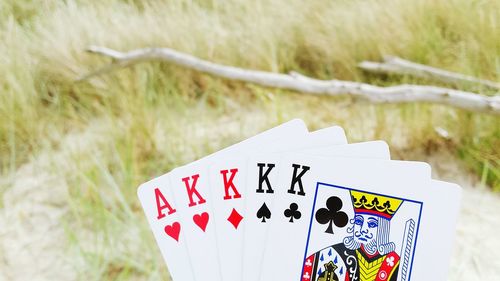 Close-up of playing cards at beach