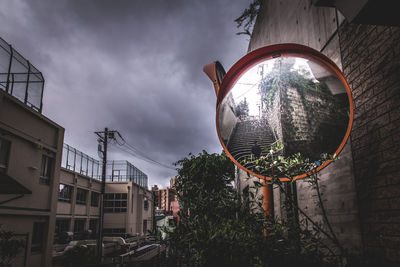 Low angle view of building against cloudy sky