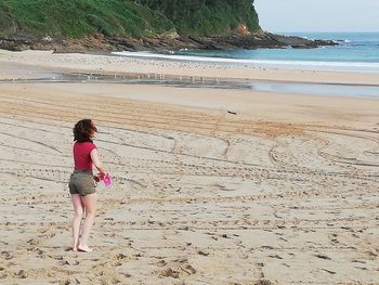 Woman standing on beach