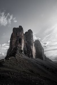 Low angle view of rock formations against sky