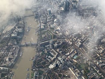 Aerial view of river amidst cityscape