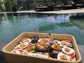 High angle view of breakfast on table by lake