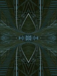 Digital composite image of illuminated bridge at night