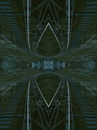 Digital composite image of illuminated bridge at night