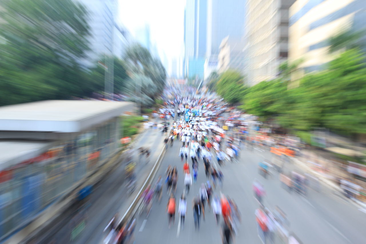 BLURRED IMAGE OF CARS ON ROAD IN CITY