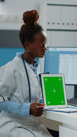 Doctor holding digital tablet at clinic