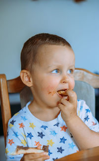 Portrait of cute boy looking away