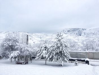 Scenic view of snow covered landscape against sky