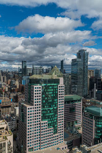 High angle view of buildings in city against sky