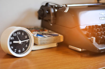 Close-up of clock on table