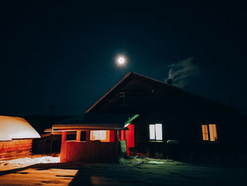 View of cottage against sky at night