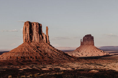 Rock formation in desert against clear sky