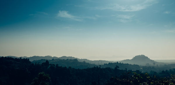 Scenic view of silhouette mountains against sky