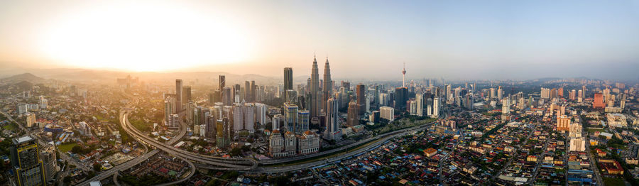 High angle view of city against sky during sunset