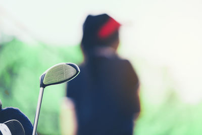 Close-up of man holding golf course