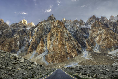 Panoramic view of road amidst mountains against sky