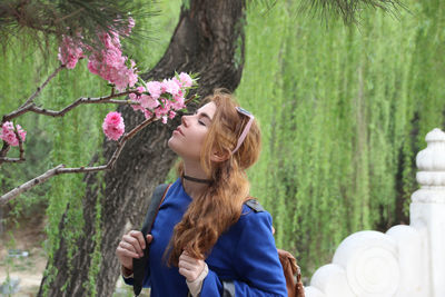 Full length of child standing on tree