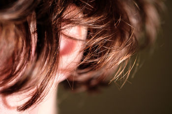 CLOSE-UP OF YOUNG WOMAN WITH HAIR