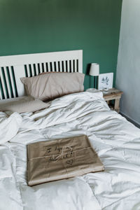 High angle view of book on bed at home