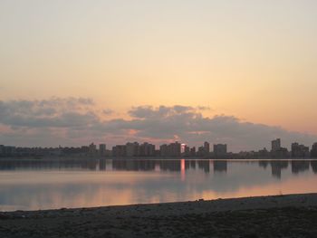 Scenic view of lake against sky during sunset