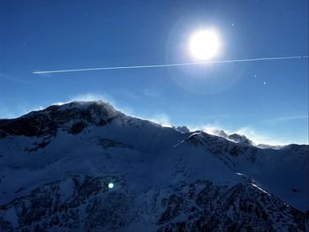 Scenic view of mountains against sky at night