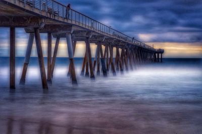 Scenic view of sea against dramatic sky