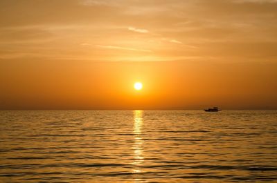 Scenic view of sea at sunset