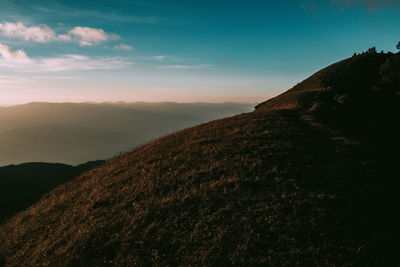 Scenic view of mountains against sky during sunset