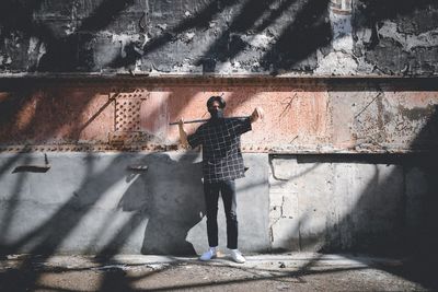 Shadow of man standing on cobblestone