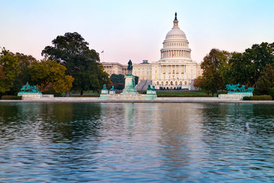 View of building with lake in foreground