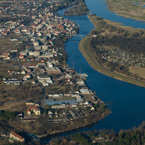 High angle view of river by town against sky