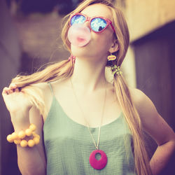 Close-up of young woman with multi colored hair