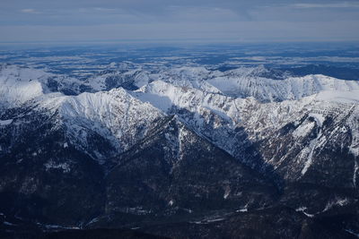 Scenic view of snowcapped mountains against sky