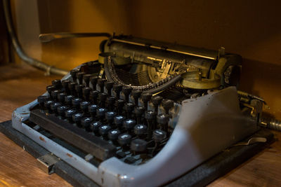 Close-up of old typewriter on table