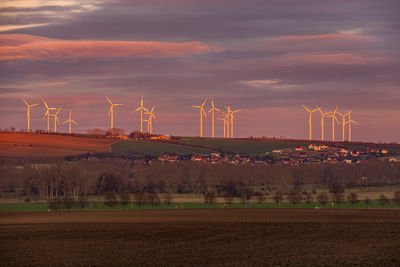 Scenic view of field against sky during sunset