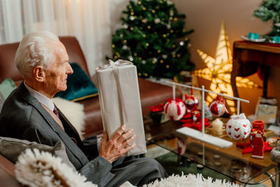 Portrait of senior man preparing food at home