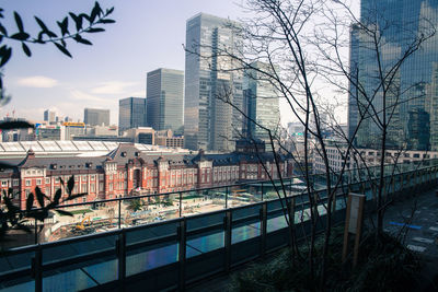 Bridge in city against sky